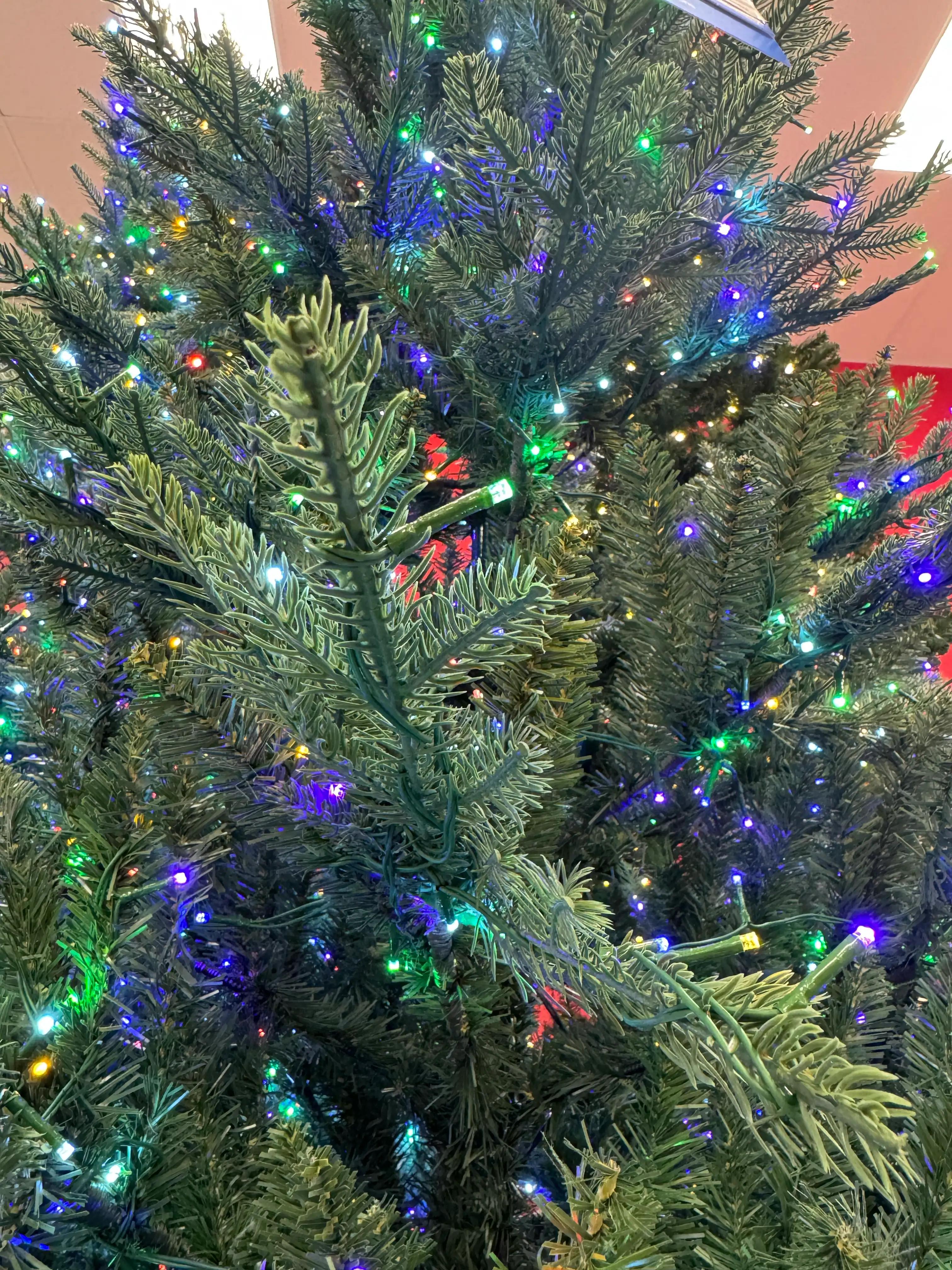 Mixed PVC and molded PE fir needles, multicolor LED lights (blue, green, white, red) densely distributed throughout branches