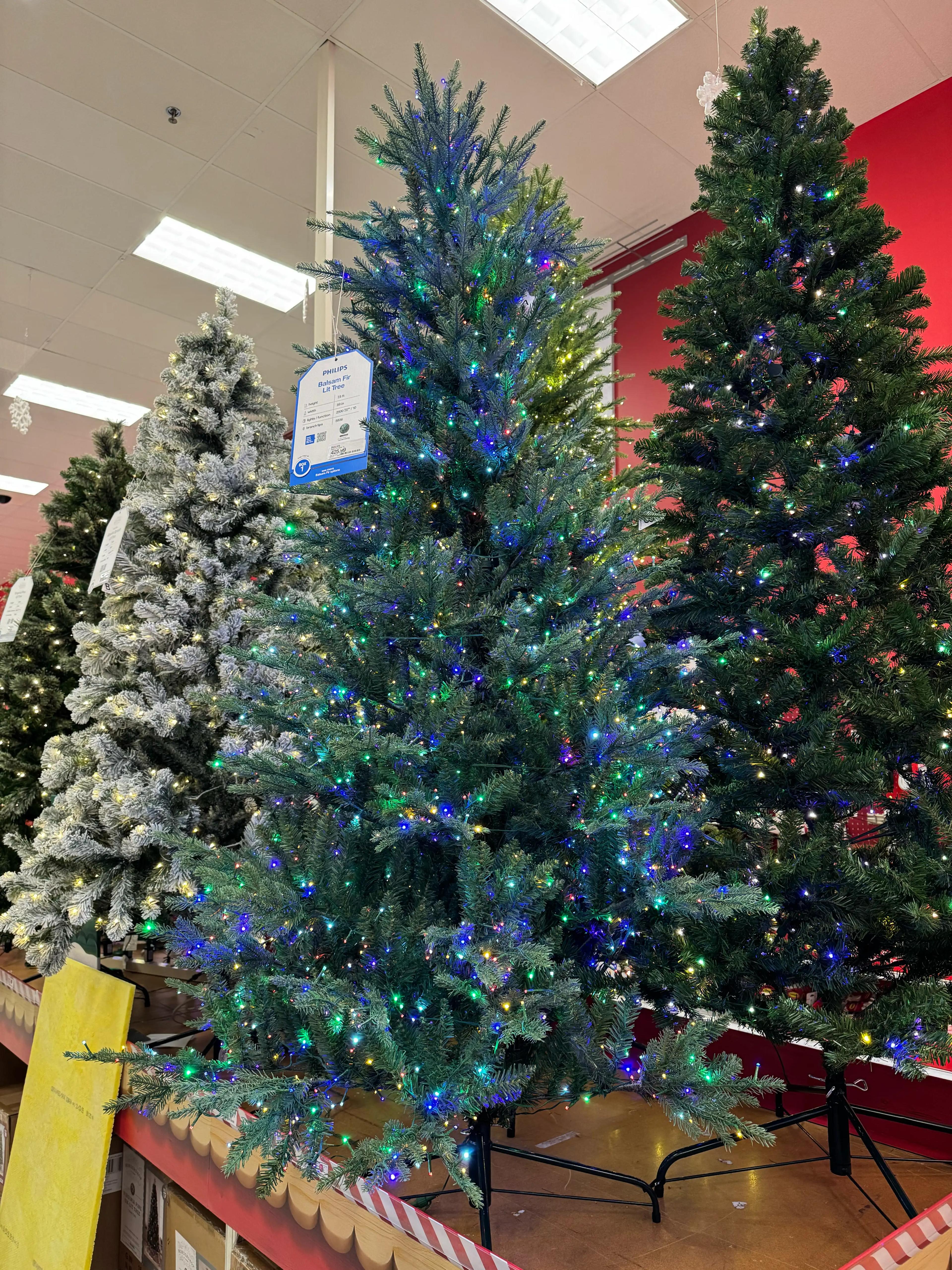 Dense spruce-style tree with full PVC branches, minimal gaps, multicolor mini bulbs with blue/green/warm lighting