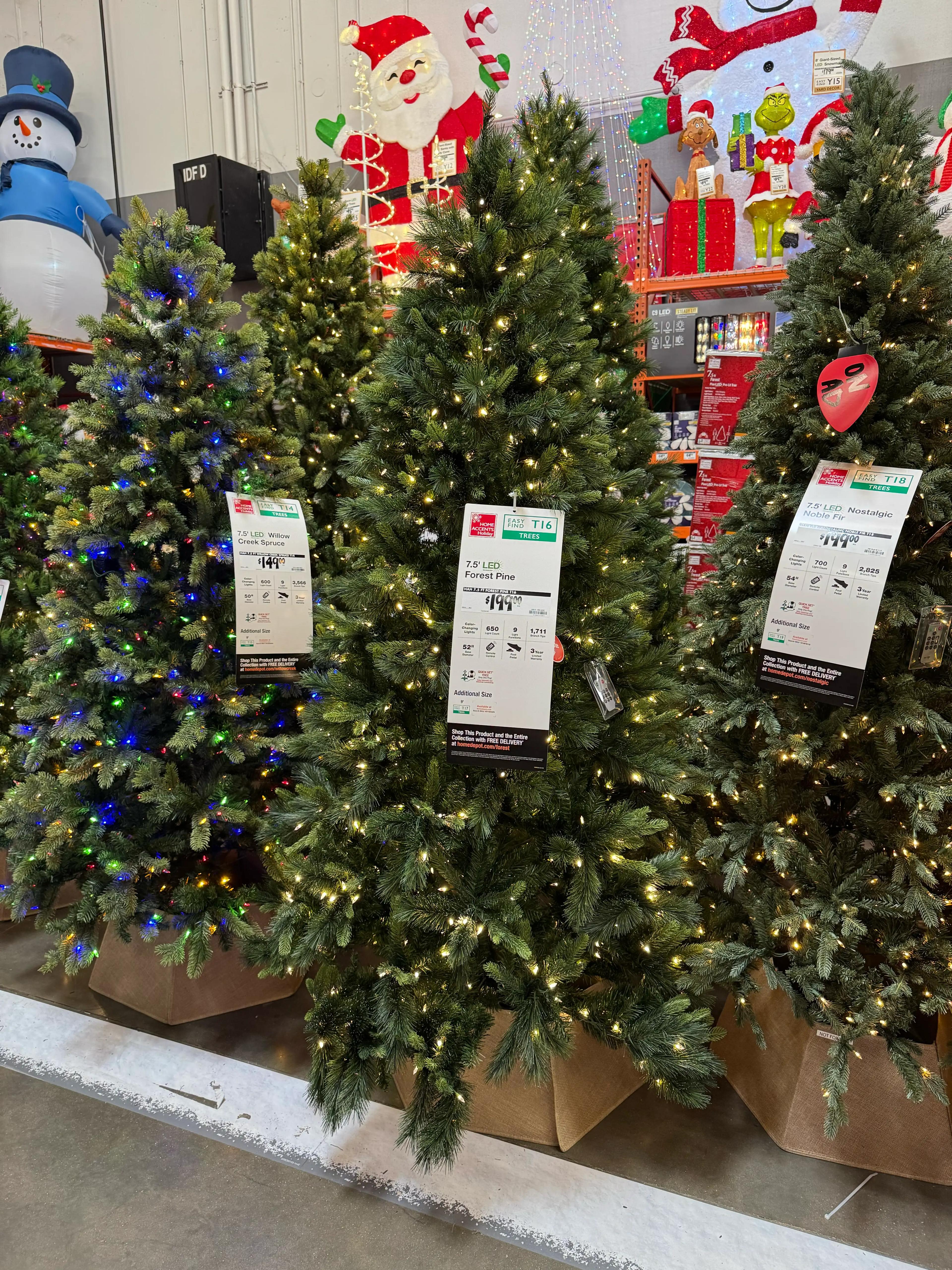 Dense PVC pine branches with full shape, warm white LED lights evenly distributed throughout, minimal visible gaps