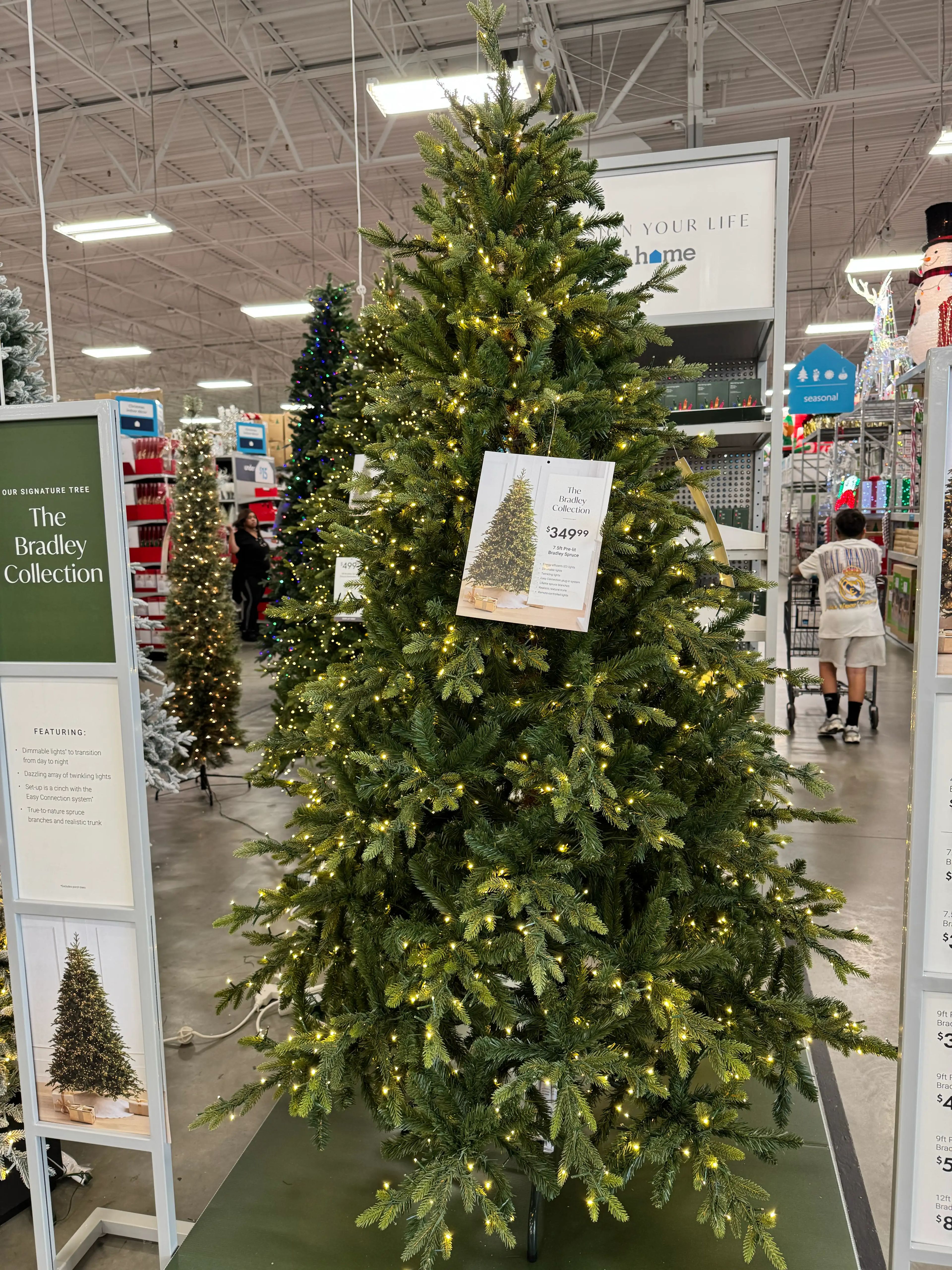 Dense spruce-style tree with mixed PVC/PE needles, minimal gaps, warm white lights evenly distributed throughout