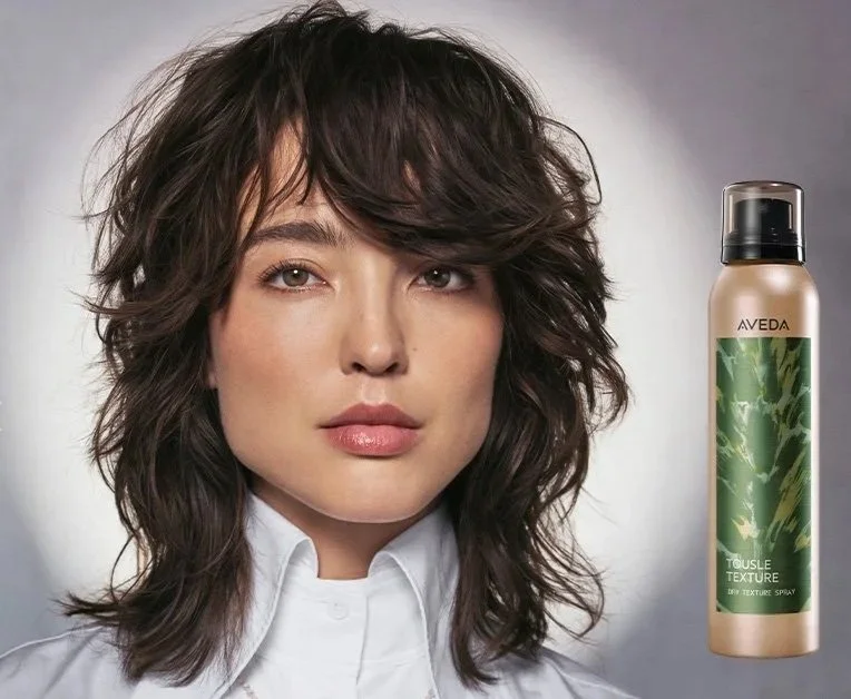 Aveda Tousle Texture Dry Spray — model with textured waves and product can