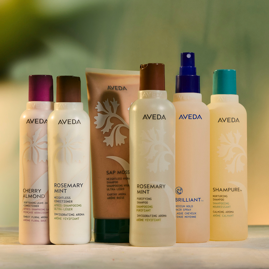 Aveda Cherry Almond, Rosemary Mint, Sap Moss, Brilliant, and Shampure product lineup