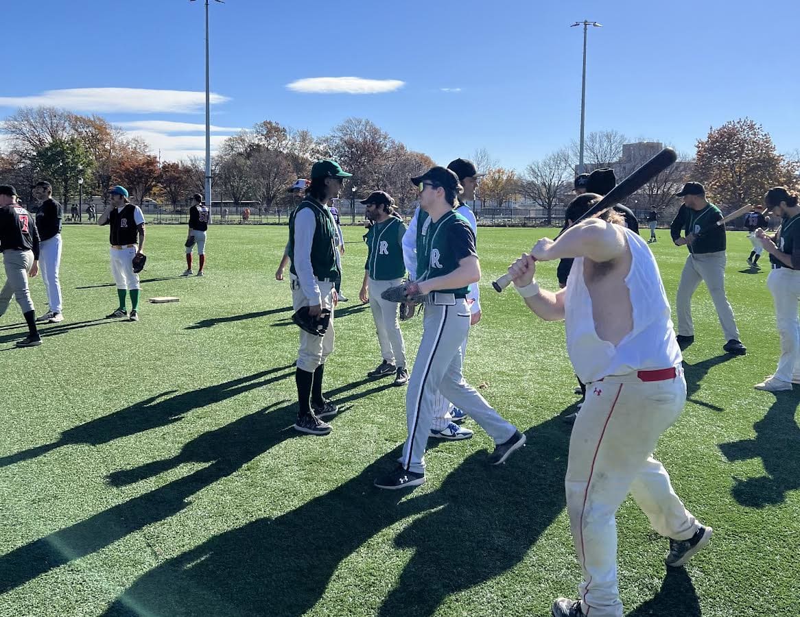 A quorum of very beautiful baseballers on a baseball field on a halycon day in Red Hook.