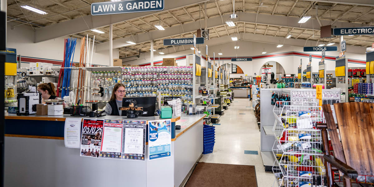 Interior view of Western Building Center showing the customer service counter area with an employee at the desk