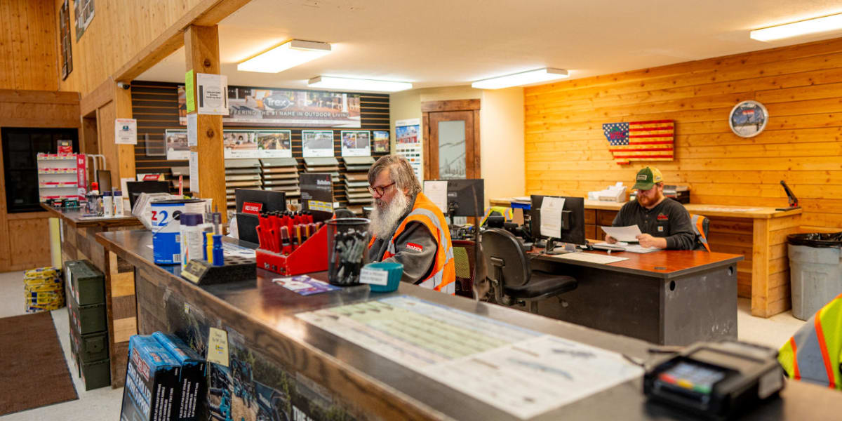 Interior view of the customer service counter and office area at Western Building Center Eureka store