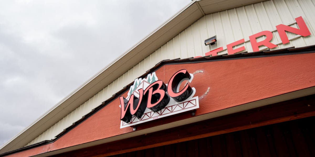Exterior view of a Western Building Center store showing the building's distinctive architecture with cream-colored metal sid
