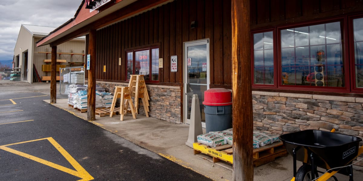 Exterior view of Western Building Center's Eureka location showing the store's covered front entrance with natural stone and