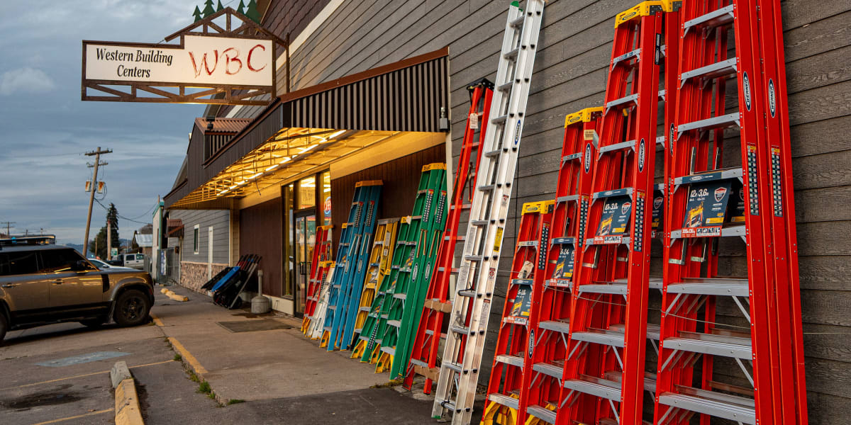 Exterior view of Western Building Center showing the storefront with horizontal wood siding and the company sign prominently