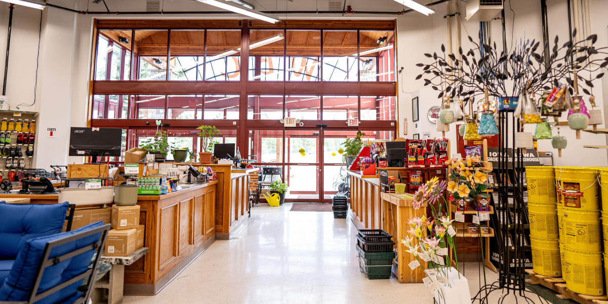 Interior view of a Western Building Center store showing the main checkout area with wooden service counters on both sides of