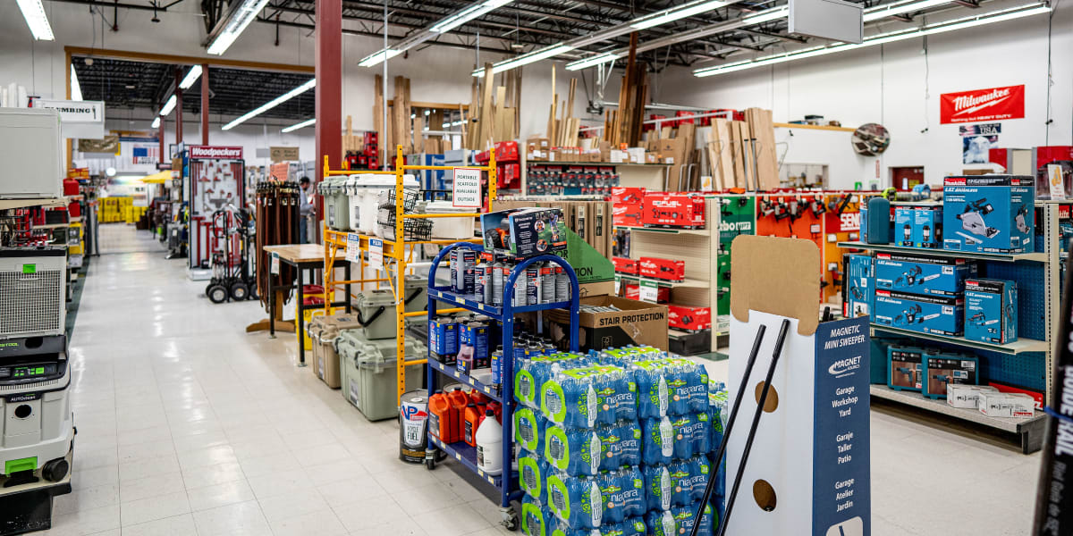 Interior view of a Western Building Center store showing multiple aisles with tools, hardware, and building supplies
