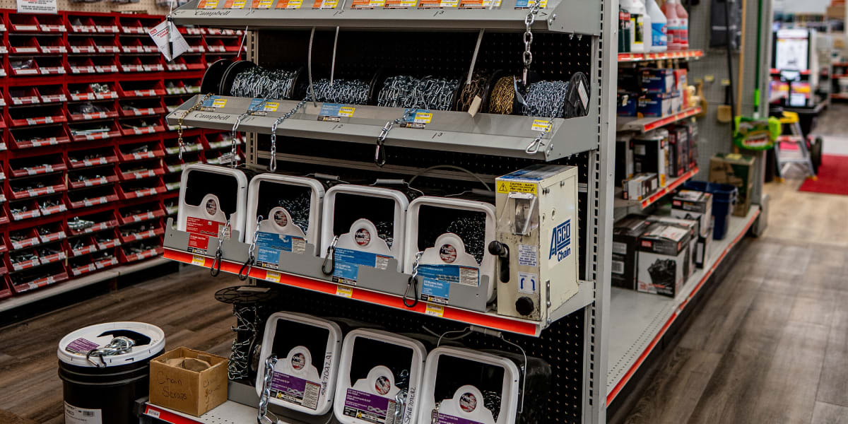 This image shows a chain and accessories display in the hardware section of the store