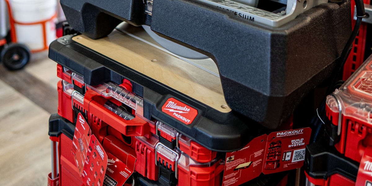A SKILSAW worm drive circular saw is prominently displayed on a red Milwaukee PACKOUT tool storage system inside a Western Bu