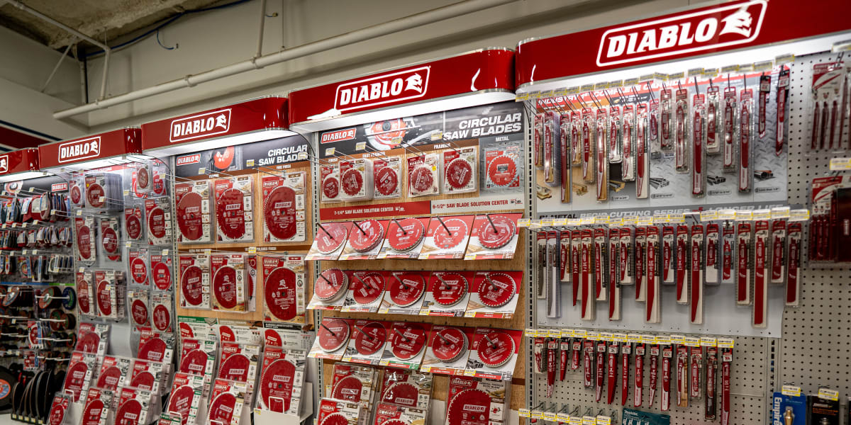 A well-organized tools aisle displaying an extensive selection of Diablo circular saw blades and hand tools