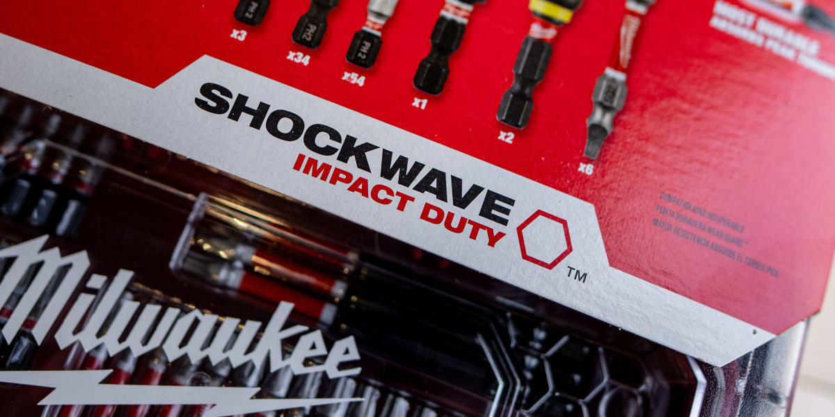 Close-up product photography showing Milwaukee Shockwave Impact Duty drill bit sets in their red retail packaging
