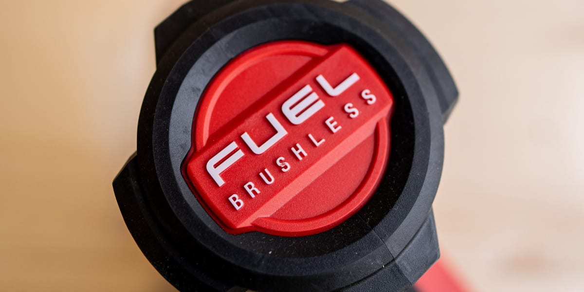 Close-up view of a Fuel branded power tool handle or component featuring a red circular logo with white text reading 'FUEL BR