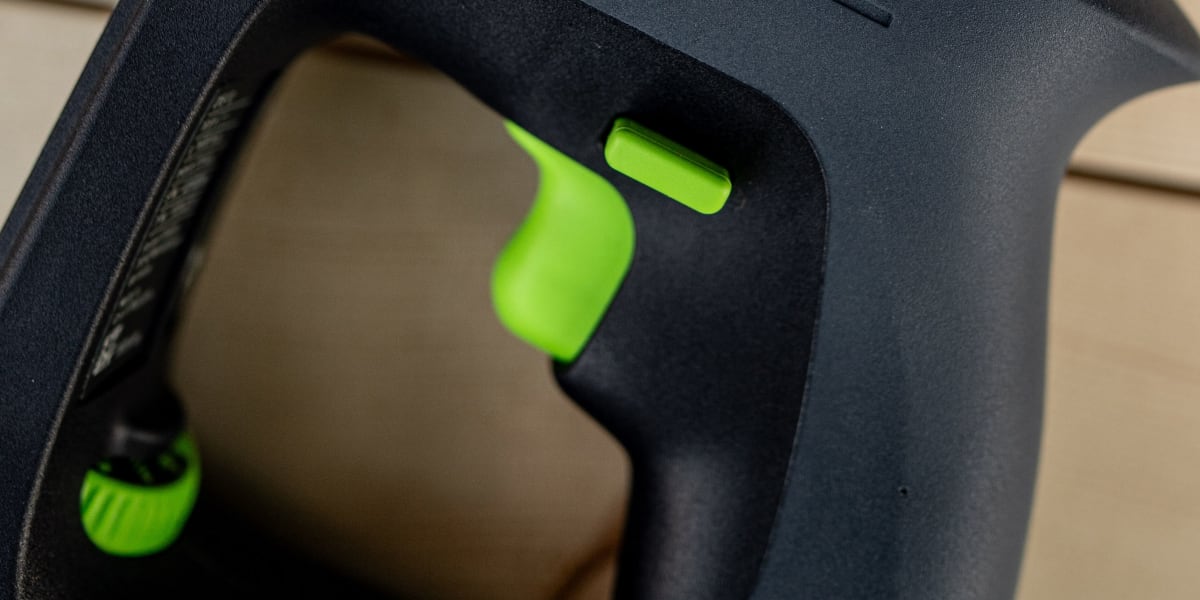 Close-up detail shot of a Festool CXS 12 cordless drill/driver showing the tool's handle, trigger, and model designation