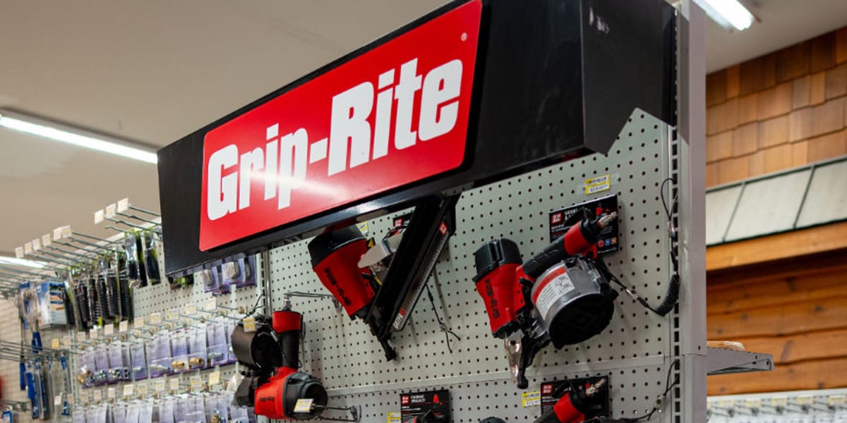 A well-organized Grip-Rite tool display in the store featuring a prominent red and black branded sign at the top