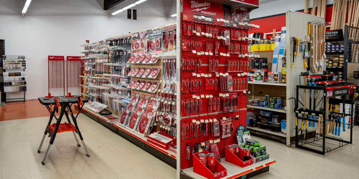 Interior view of the tools department showing a prominent red Diablo and Milwaukee tool display with circular saw blades and