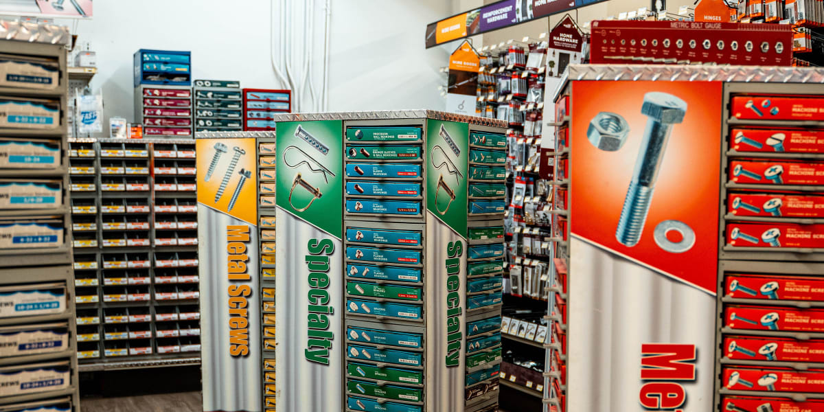Interior view of aisle 13 showing organized displays of small hardware items including specialty fasteners, bolts, and metric
