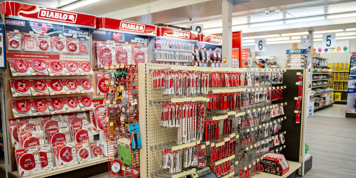Interior view of the tools department showing an extensive Diablo brand display featuring circular saw blades, cutting tools,