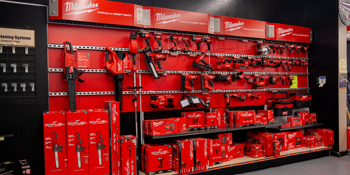 This image shows a comprehensive Milwaukee tool display in the store's tool department