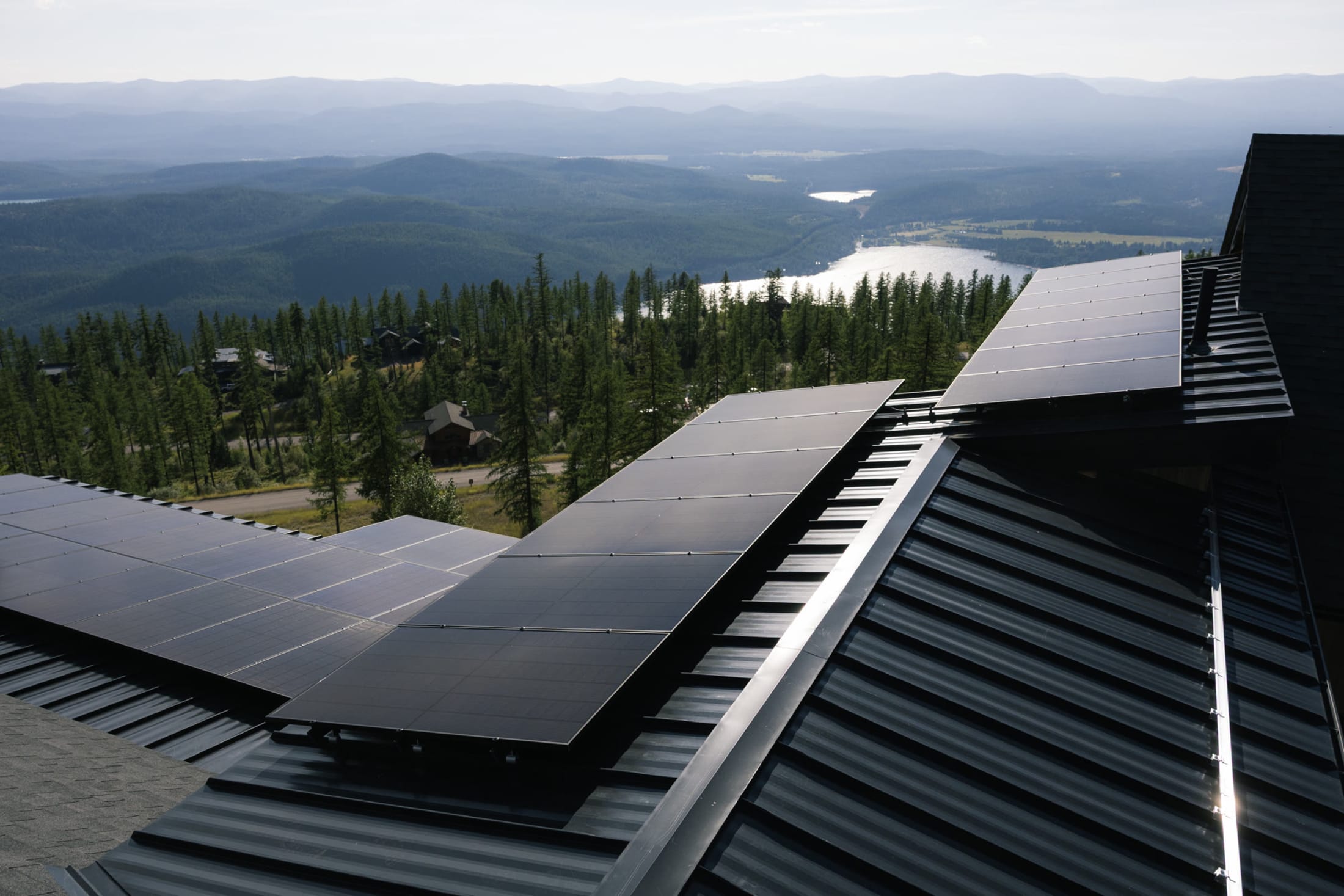 A Northstone rooftop solar array above a northwest Montana lake valley