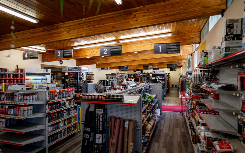 WBC store associate helping a customer at the service counter