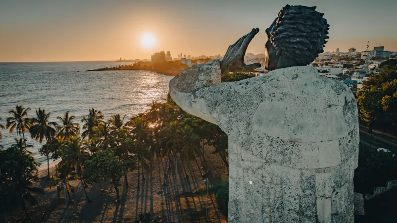 Family on white rocks at sunset in Santo Domingo, Caribbean beach family photographer with golden light