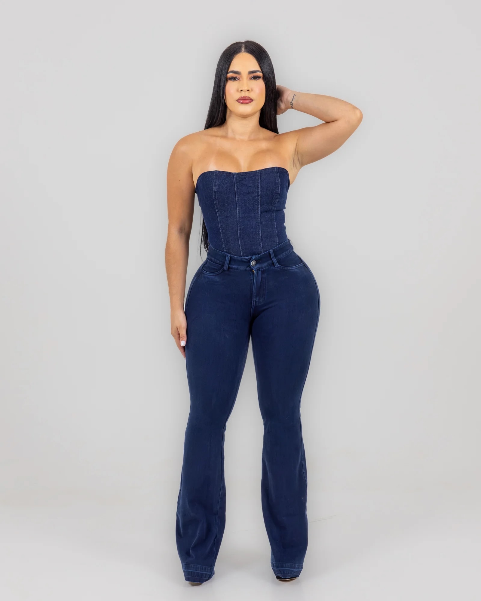 Lipo Jeans — navy lace-back top with dark flared jeans, front view