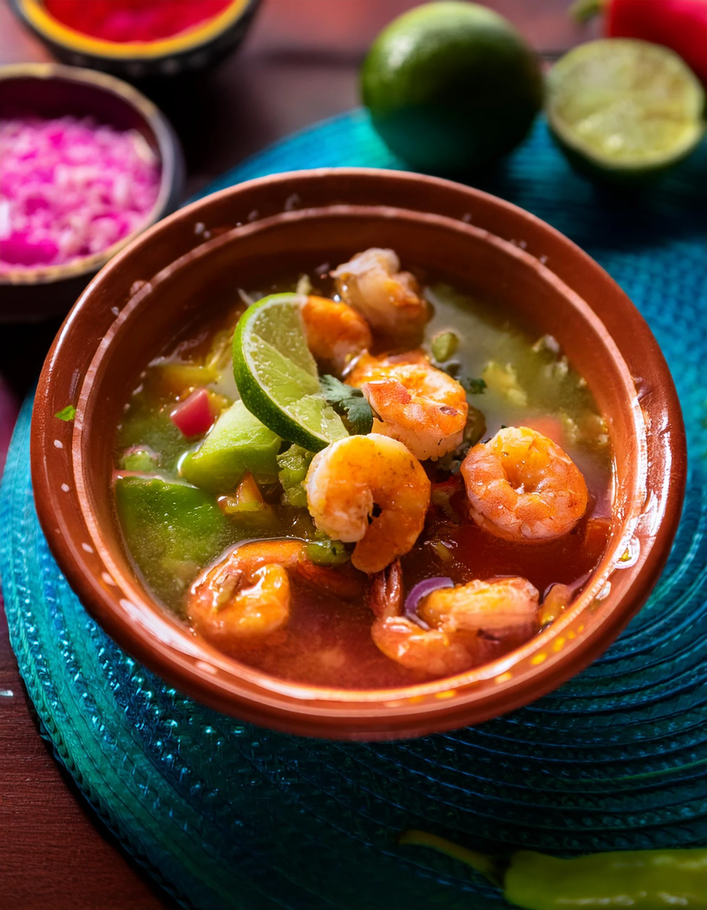 Shrimp in spicy red "a la diabla" sauce served in a clay bowl