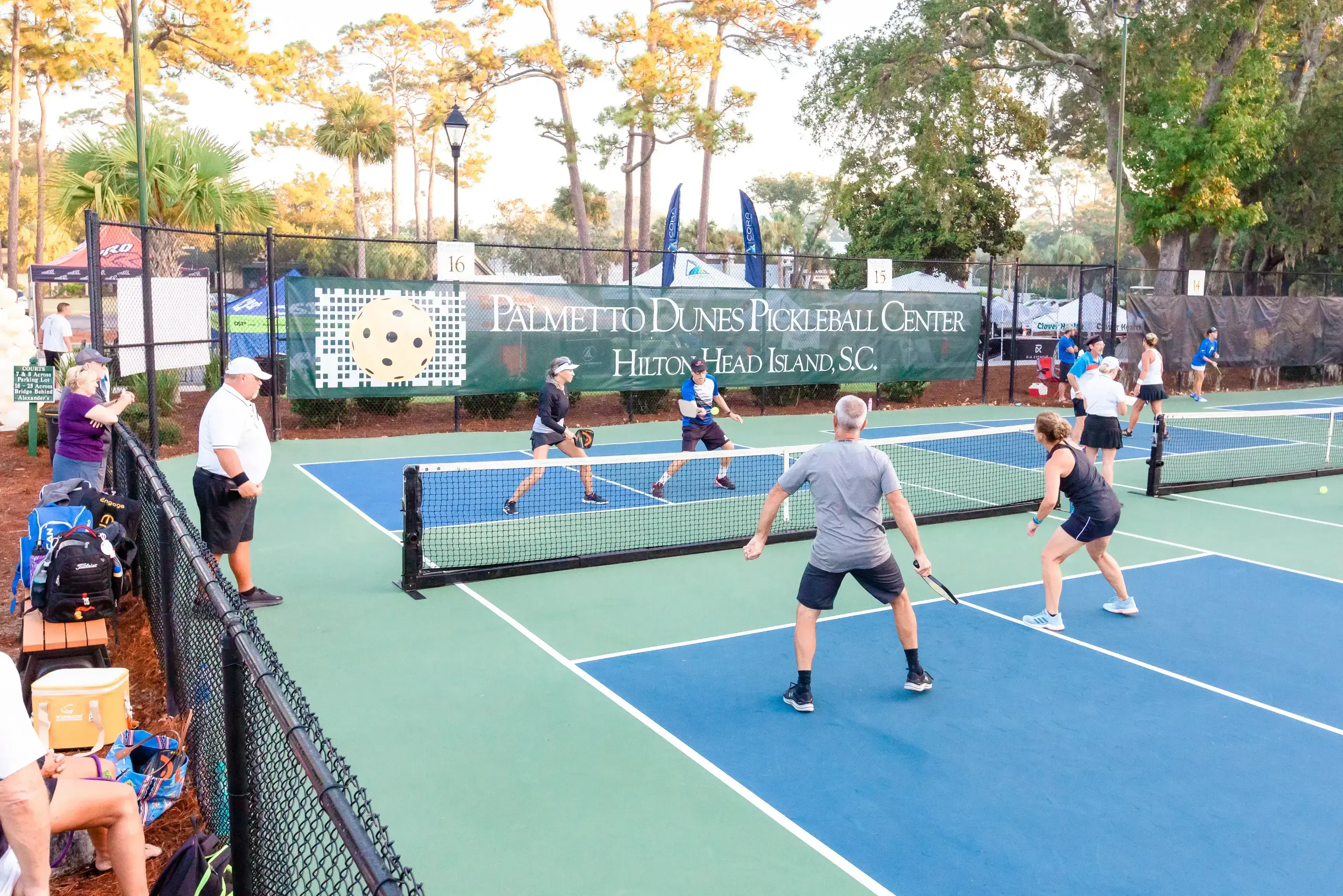 teams playing pickleball at Palmetto Dunes Pickleball center with spectators watching