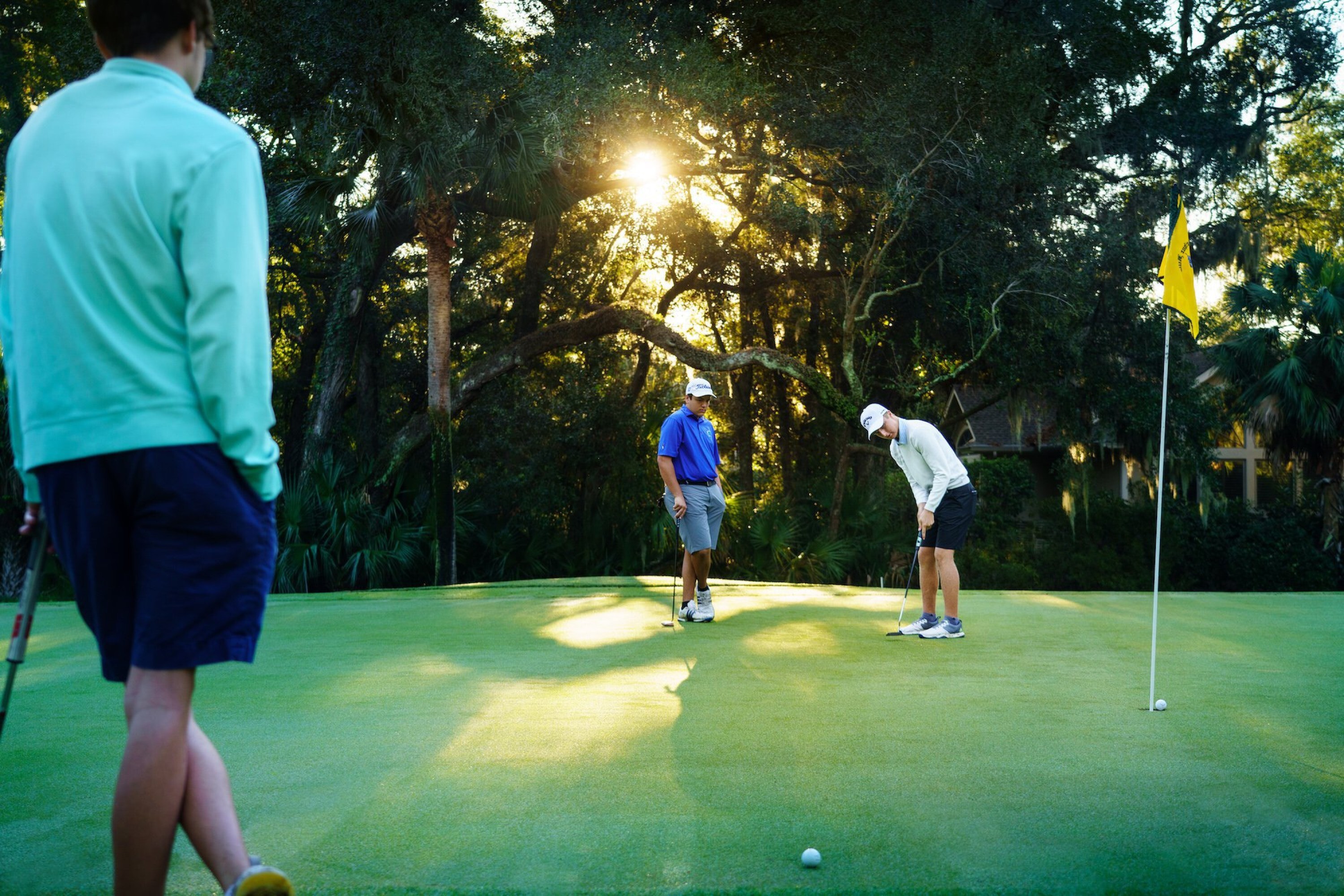 Group of golfers putting at Arthur Hills Course