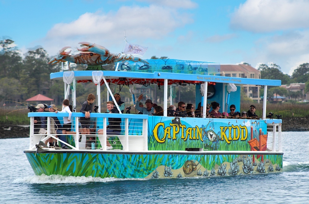 exterior shot of Captai Kidd boat leaving the marina with the Crab on top