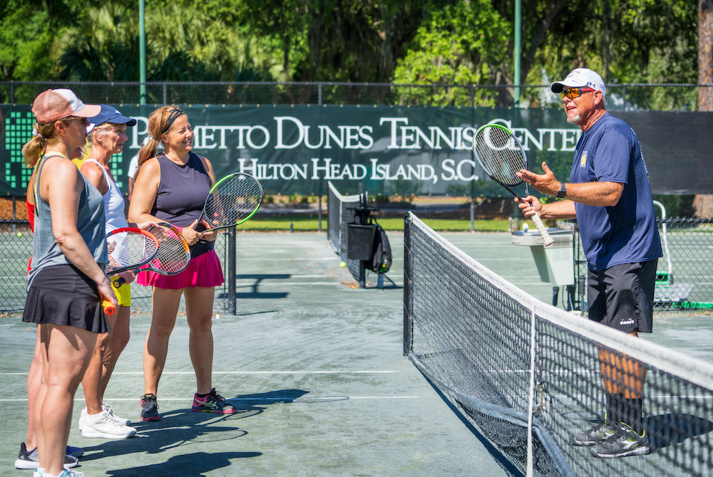 three women at a tennis lesson at Palmetto Dunes Pickleball Center