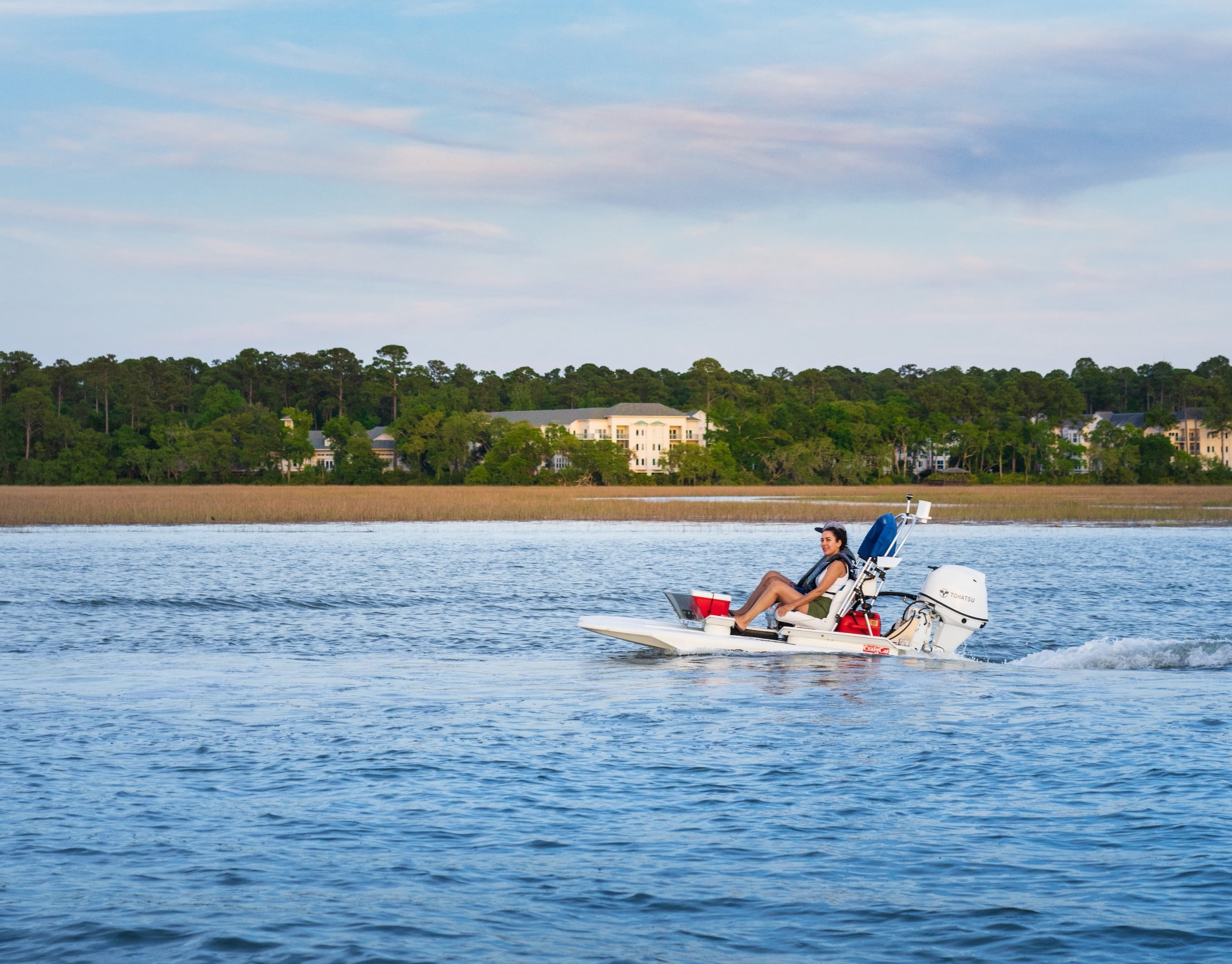 side view of a craigcat boat cruising along the water