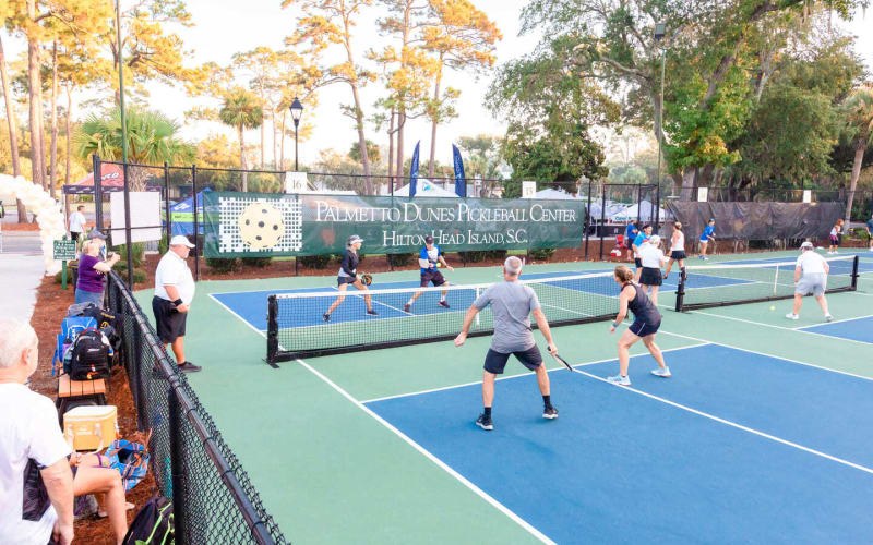 teams playing pickleball at Palmetto Dunes Pickleball center with spectators watching