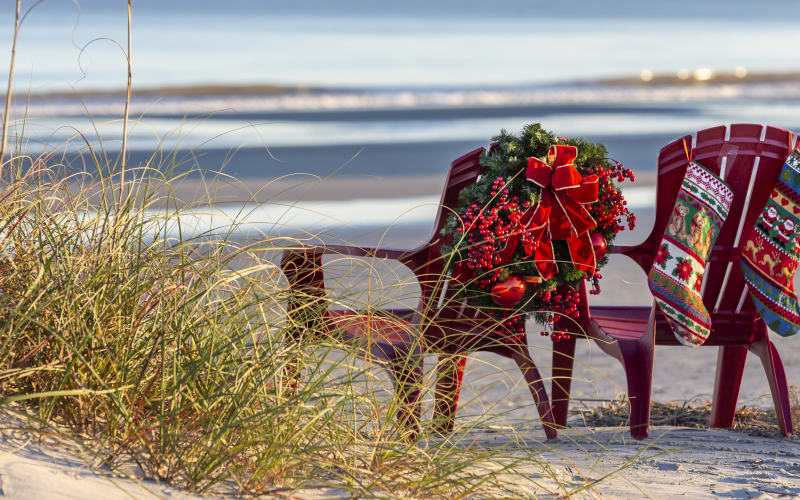 Chairs on beach with holiday decor