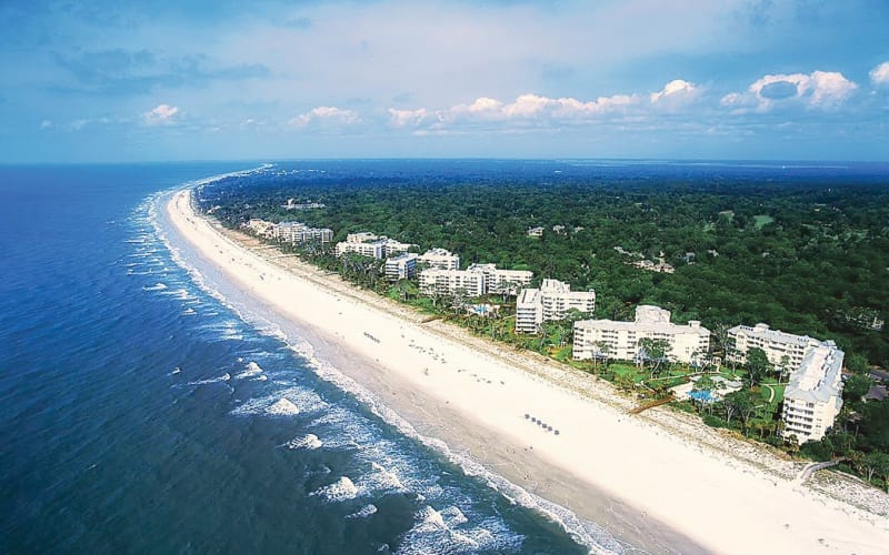 Aerial view of Palmetto Dunes beach and buildings