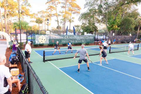 teams playing pickleball at Palmetto Dunes Pickleball center with spectators watching