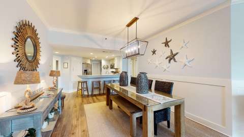 Dining room and kitchen in a villa at Barrington Court