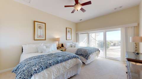 Bedroom with two bed at the Beach Villas