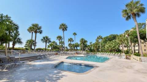 Community pool and kiddie pool with beach access at Captain's Cove