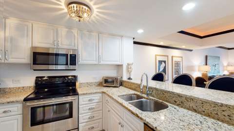 Kitchen at a villa at Captain's Quarters