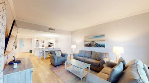 Living room, dining area, and kitchen at a villa in Captain's Walk