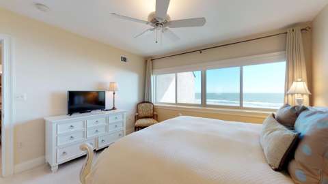 Bedroom with an ocean view at a villa in Captain's Walk