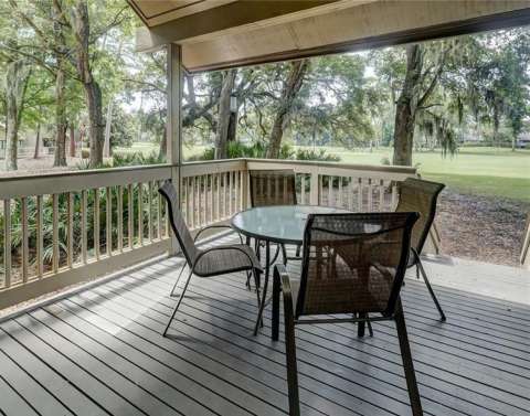 Porch with a table at a villa in Fazio Villas