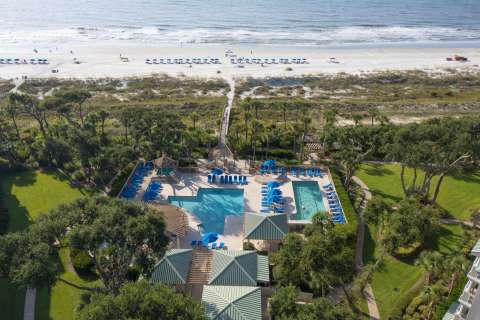 Aerial view of the pool and beach access at Hampton Place Villas