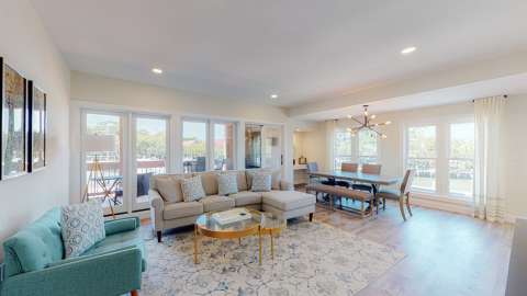 Living room and dining room in a villa at Harbourside