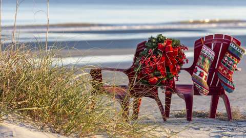 Chairs on beach with holiday decor