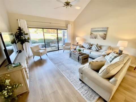 Living room with porch access at an Inverness Village villa